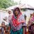 Woman in headscarf stands with community in Bangladesh