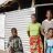 A family posing outside their home in Malawi