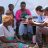 people sitting in circle talking in malawi