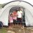 A family posing in front of a tent in the Philippines