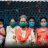 6 women and a child wearing medical face masks in India