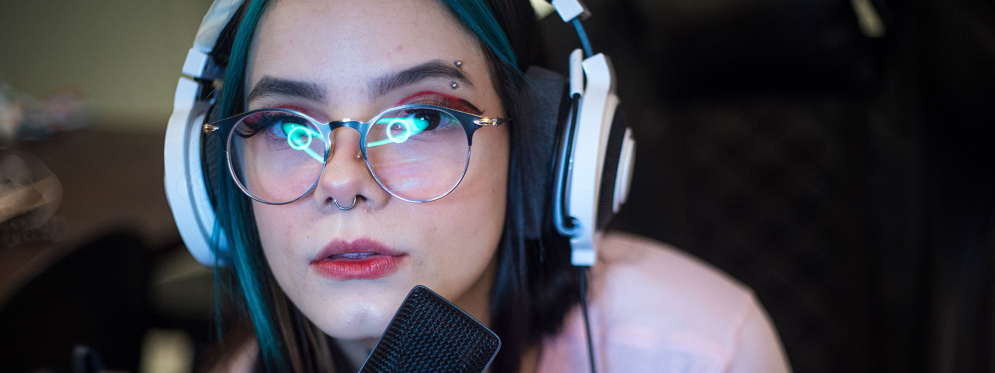 female gamer wearing headphone with microphone