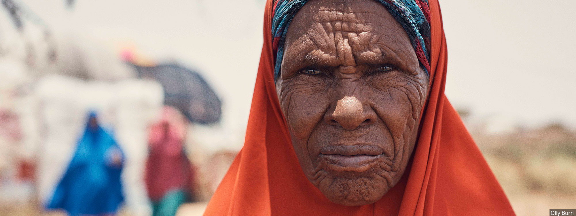 portrait of somali woman in headscarf by Olly Burn